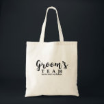 Groom's Wedding Team, Crew, Squad, Modern Script Tote Bag<br><div class="desc">Groom's Team or Bride's Team? Either way, your bridal party and guests are sure to love this fun personalised tote bag! A fun trendy script font adorns the front of the bag and below there's space for two lines of custom text - add the wedding date, location, etc. You can...</div>