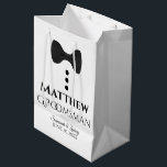 Groomsman Wedding Gift Bag with Black Tie<br><div class="desc">This gift bag is designed for your groomsmen. The design features black text and a black tie with buttons on a white background. Includes a space for his name as well as the name of the couple and the wedding date. Fill with gifts, favours, candy, booze, or any other sort...</div>
