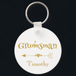 Groomsman wedding token key ring<br><div class="desc">Let your groomsman know how much you appreciate his service at your wedding. Displaying a white background with gold font, "Groomsman" is written in fun text with a golden arrow underneath. At the very bottom is a place to insert the groom's name. Purchase yours today! Arrow: Clipart by Huckleberry Hearts,...</div>