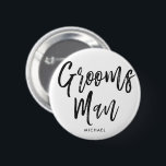 Groomsmen | Black Script Style Custom Wedding 6 Cm Round Badge<br><div class="desc">A little something for your ultra special groomsmen.  Have them happy to stand by your side on your special day of matrimony with this unique personalised name button.

It features the words "groomsmen" in an elegant script style text.  Underneath this is a spot for a custom name.</div>