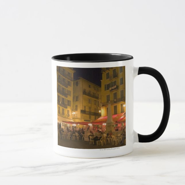 Group of people sitting at a sidewalk cafe, mug (Right)