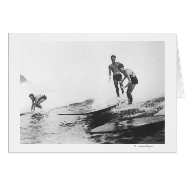 Group of Surfers in Honolulu, Hawaii Surfing (Front Horizontal)