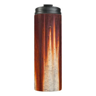 Grunge wall background with sags of rust thermal tumbler