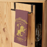 GRYFFINDOR™ Determination Courage Bravery Crest Tea Towel<br><div class="desc">Show your house pride with this bold Gryffindor™ crest design, celebrating the values that define the bravest of witches and wizards. Featuring the iconic lion standing proudly before a shield, this striking artwork highlights Gryffindor’s core traits — Courage, Determination, and Bravery — in a powerful, vintage-inspired layout. The rich house...</div>