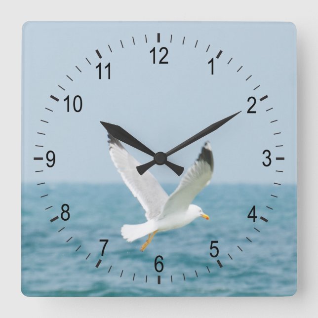 Gull flying above sea square wall clock (Front)