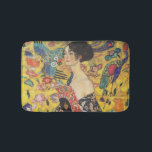 Gustav Klimt Lady With Fan Art Nouveau Painting Bath Mat<br><div class="desc">Gustav Klimt Lady With Fan Art Nouveau Painting This half portrait of a beautiful woman shows a yellow background with asiatic ornaments, colourful birds and lotus flowers. The lady wears a dress in the style of a kimono imprinted with motives of a Chinese dragon dress. Beautiful artistic romantic decorative fine...</div>