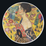 Gustav Klimt Lady With Fan Art Nouveau Painting Ceramic Knob<br><div class="desc">Gustav Klimt Lady With Fan Art Nouveau Painting This half portrait of a beautiful woman shows a yellow background with asiatic ornaments, colourful birds and lotus flowers. The lady wears a dress in the style of a kimono imprinted with motives of a Chinese dragon dress. Beautiful artistic romantic decorative fine...</div>