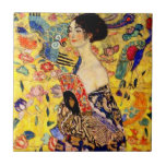 Gustav Klimt Lady with Fan Ceramic Tile<br><div class="desc">Tile featuring Gustav Klimt’s oil painting Lady with Fan (1918). A woman wearing a blue kimono holds a red fan against a colourful yellow background of flowers and peacocks. A great gift for fans of Japonisme and European art.</div>