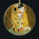 Gustav Klimt The Kiss Vintage Art Nouveau Painting Ceramic Ornament<br><div class="desc">Gustav Klimt The Kiss Vintage Art Nouveau Painting The Kiss (In German: Der Kuss) was painted by the Austrian Symbolist painter Gustav Klimt between 1907 and 1908, the highpoint of his Golden Period, when he painted a number of works in a similar gilded style. The painting is widely considered a...</div>