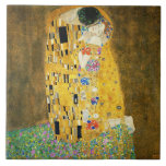 Gustav Klimt The Kiss Vintage Art Nouveau Painting Ceramic Tile<br><div class="desc">Gustav Klimt The Kiss Vintage Art Nouveau Painting The Kiss (In German: Der Kuss) was painted by the Austrian Symbolist painter Gustav Klimt between 1907 and 1908, the highpoint of his Golden Period, when he painted a number of works in a similar gilded style. The painting is widely considered a...</div>