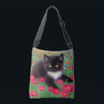 Gustav Klimt Tuxedo Cat Crossbody Bag<br><div class="desc">Crossbody Bag featuring a Gustav Klimt tuxedo cat! This adorable black and white kitty sits in a field of red,  blue,  white,  and orange flowers. An awesome gift for cat lovers and Austrian art enthusiasts!</div>