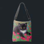 Gustav Klimt Tuxedo Cat Crossbody Bag<br><div class="desc">Crossbody Bag featuring a Gustav Klimt tuxedo cat! This adorable black and white kitty sits in a field of red,  blue,  white,  and orange flowers. An awesome gift for cat lovers and Austrian art enthusiasts!</div>