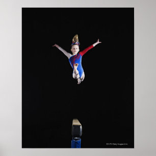 Gymnast (9-10) leaping on balance beam poster