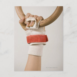 Gymnast hand holding ring postcard