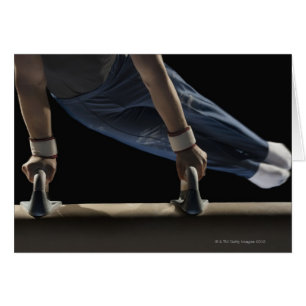 Gymnast swinging on pommel horse