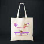 Gymnastics tote bag personalised<br><div class="desc">Cute gymnastics girls,  one on the balanced beam and one doing a split on the floor,  pink and purple leotards and balloons.  Personalise this design with your choice of name.  Great Christmas or birthday gift for  your little gymnast.</div>