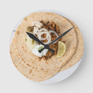 Gyros pita with tzatziki coleslaw olives and feta round clock