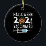 Halloween 2021 Vaccinated Funny Costume Ceramic Ornament<br><div class="desc">Halloween 2021 Vaccinated Funny Costume
vaccinated, vaccine, halloween, 2021, gift, ideas, scary, pumpkin, birthday, halloween trick or treat, spooky, horror, zombie, black, ghost, trick or treat, witch, skull, humour, vintage, retro, gifts</div>
