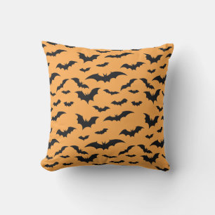 Halloween bats on orange background cushion