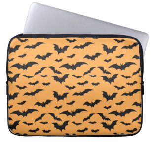 Halloween bats on orange background laptop sleeve