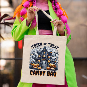 Halloween-decorated enchanted house tote bag