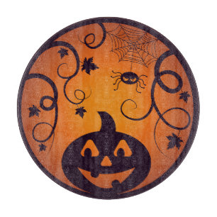 Halloween Jack o lantern pumpkin face and spider Cutting Board