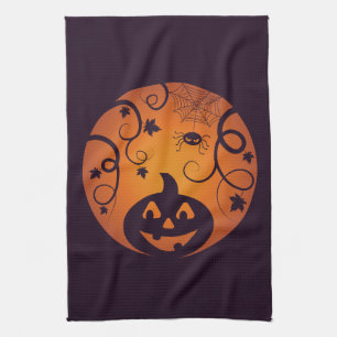 Halloween Jack o lantern pumpkin face and spider Tea Towel