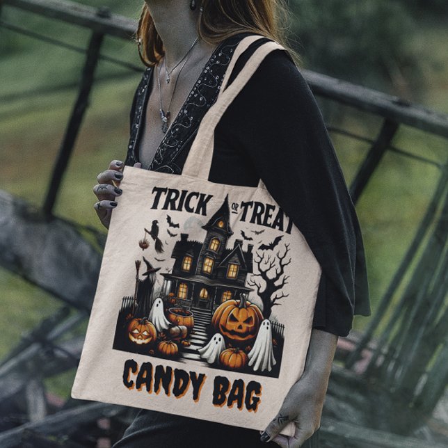 Halloween night at a haunted house with pumpkins tote bag (Creator Uploaded)