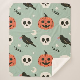 Halloween seamless pattern with ravens, skulls and sherpa blanket