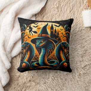 Halloween snakes coiled under a spooky moonlight cushion