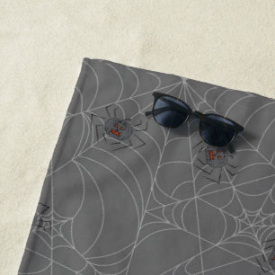 Halloween spiders web and pumpkins  beach towel