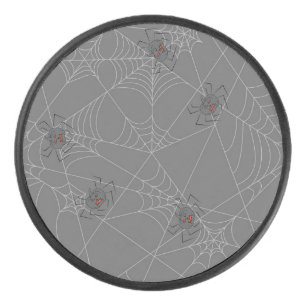 Halloween spiders web and pumpkins hockey puck