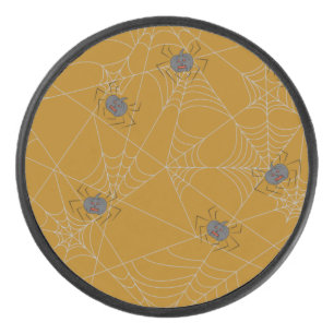 Halloween spiders web and pumpkins hockey puck