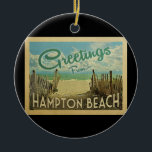 Hampton Beach Vintage Travel Ceramic Ornament<br><div class="desc">This Greetings From Hampton Beach vintage postcard design features a sandy beach with a beautiful turquoise ocean water and above the sea,  a blue sky with billowy white clouds. In vintage travels style.</div>