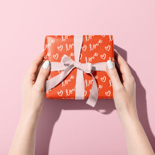 Hand drawn hearts & love lettering in red wrapping paper