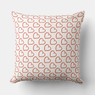 Hand drawn hearts pattern red on white cushion