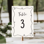 Hand Drawn Squiggle Frame Wedding Table Number<br><div class="desc">Celebrate in style with our quirky and fun wedding table number featuring a hand drawn squiggle frame and casual handwritten script in a neutral colour scheme of dark grey on ecru.</div>