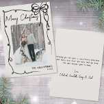 Hand Drawn Vintage Whimsical Christmas Holiday Card<br><div class="desc">Send holiday cheer with this vertical Christmas card design. The front features a vertical photo in the centre, framed by a swirling ribbon-style doodle border. A cute hand-drawn coquette bow sits in the top right corner, while “Merry Christmas” appears in a handwritten script at the top left. The bottom right...</div>