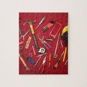 Hand held tools and tool bag red background jigsaw puzzle