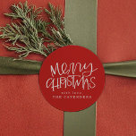 Hand Lettered Merry Christmas Classic Round Sticker<br><div class="desc">Top of your mailing or party with these festive stickers featuring a whimsical "Merry Christmas" and personalise with your own name against a Christmas-y red background!</div>