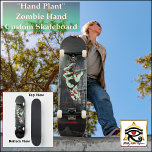 Hand Plant | Zombie Hand | Custom Skateboard<br><div class="desc">Hand Plant | Zombie Hand | Custom Skateboard Pull off the ultimate hand plant on this cryptic masterpiece. Titled: Hand Plant Featuring: Haunted Mansion with barbed wire fence and lunatic zombie hand. Deck Type: 7 3/4" Skateboard Deck Whether you’re doing grinds on the half-pipe or kickflips in the street, this...</div>