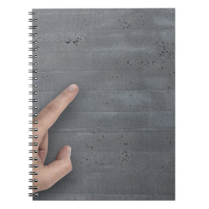 Hand showing concept on copy space template notebook