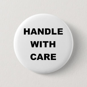 HANDLE WITH CARE 6 CM ROUND BADGE