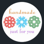 "Handmade" holiday gift label<br><div class="desc">Cute,  classy gift label for the holidays,  featuring kids' snowflake cutouts.  Perfect for any homemade gift,  from a tin of cookies to a hand-knit scarf.  Personalise in a flash by replacing our sample name with yours.  Creators give half their proceeds to children's charities.</div>