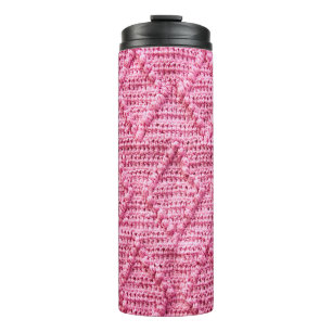 Handmade knitting lozenge pattern background. thermal tumbler