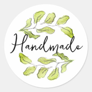 Handmade with green watercolor leafs classic round sticker