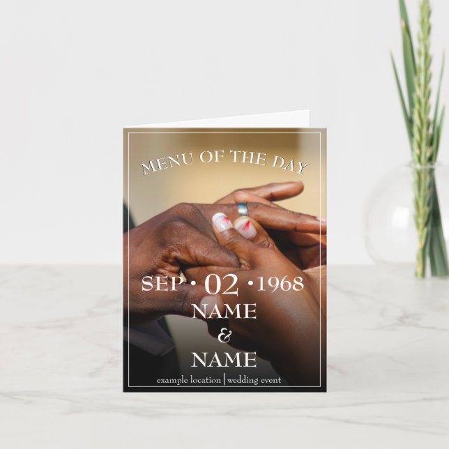 Hands of a coloured wedding couple pin on ring announcement (Front)