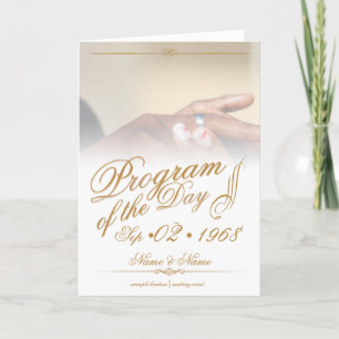 Hands of a coloured wedding couple pin on ring gol holiday card