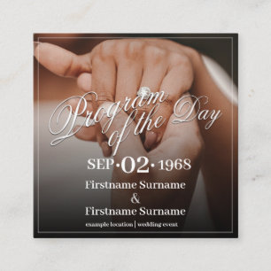 Hands of a wedding couple with ring enclosure card