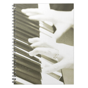 hands playing the piano photograph sepia notebook